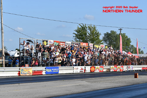 Crowd standing for the national anthem
